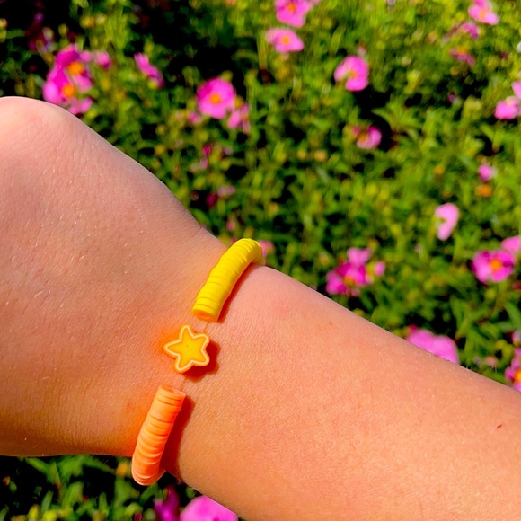 Other - Yellow and orange bracelet with star charm
